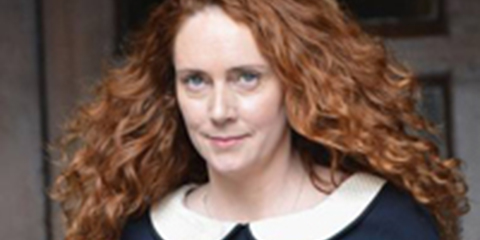 Ex-Murdoch editor charged in hacking scandal